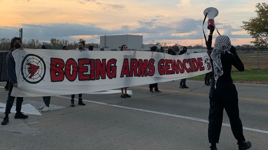 Young activists blocking the entrances to Boeing Building 598 in Missouri