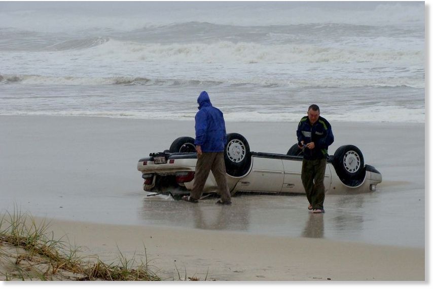 gold coast beach erosion. A car ends up on a each after