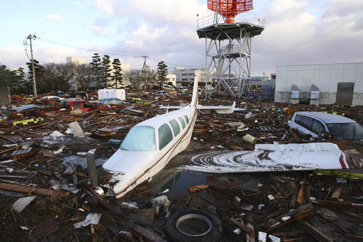 Click to enlarge A light aircraft and vehicles swept