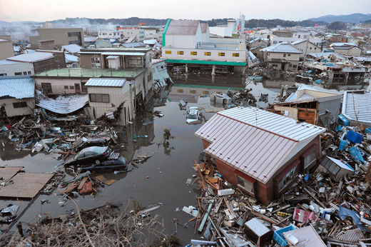 Click to enlarge Buildings swept by a tsunami
