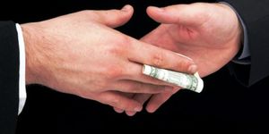 Click to enlarge money changing hands