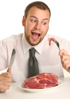 man_eating_raw_steak.jpg