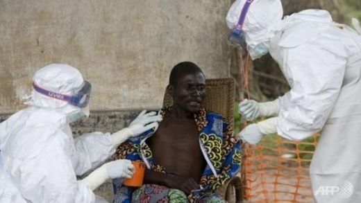 Nurses take care of a patient with Ebola