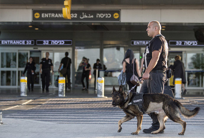 security officer leads a dog