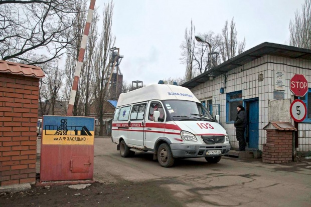 Emergency vehicles exit the Zasyadko coal mine in Donetsk