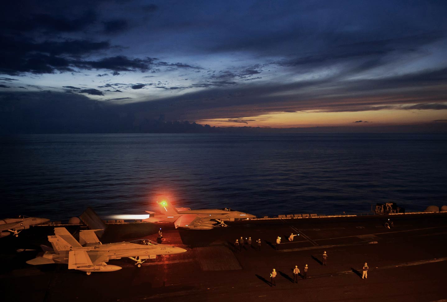 Military ship at night open sea