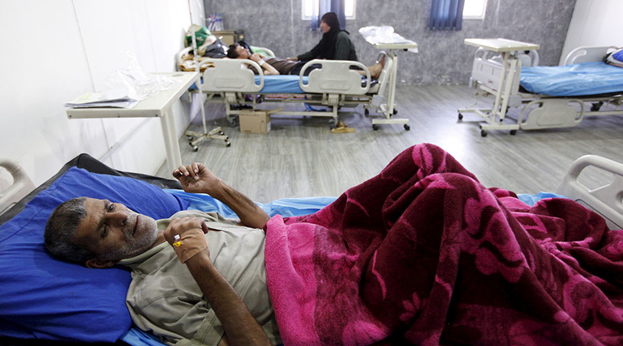 An Iraqi resident suffering from cholera waits for medical treatment at a hospital in Baghdad, September 21, 2015.
