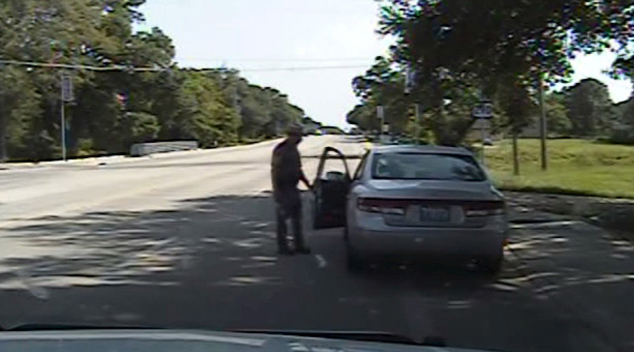 Texas state trooper Brian Encinia opens the driver's side door as he orders Sandra Bland out of her vehicle, in this still image captured from the police dash camera video from the traffic stop of Bland's vehicle in Prairie View, Texas, July 10, 2015