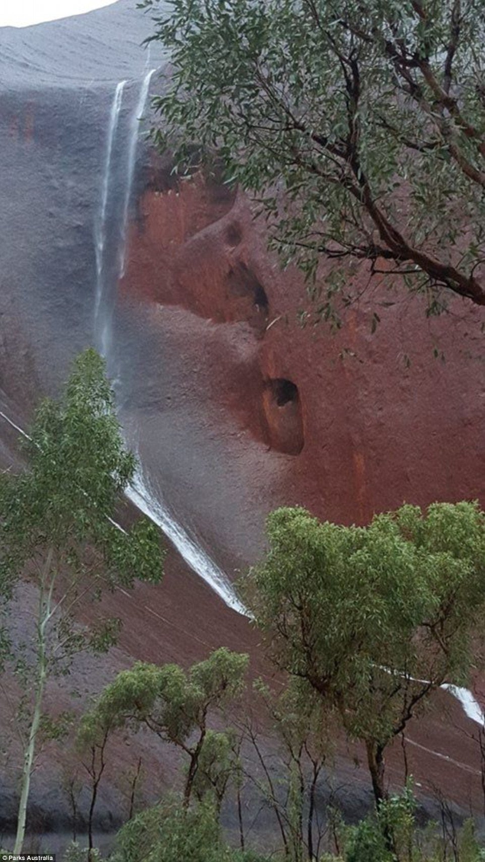 Rain on the rock!- Australia’s iconic red rock 