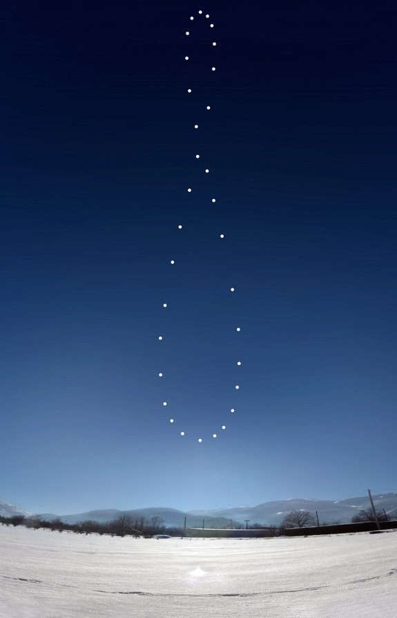Astrophotographer Giuseppe Petricca took the image from Sulmona, Abruzzo, Italy. The dots forming a curved figure-8 in the sky mark where the sun appeared every day at the same time in a pattern called an analemma.