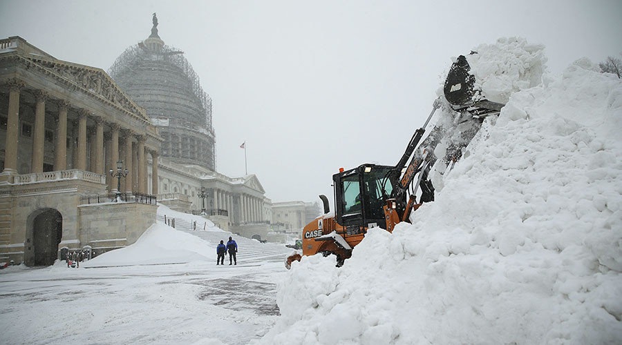 A bulldozer clears snow on the East Front of the U.S. Capitol