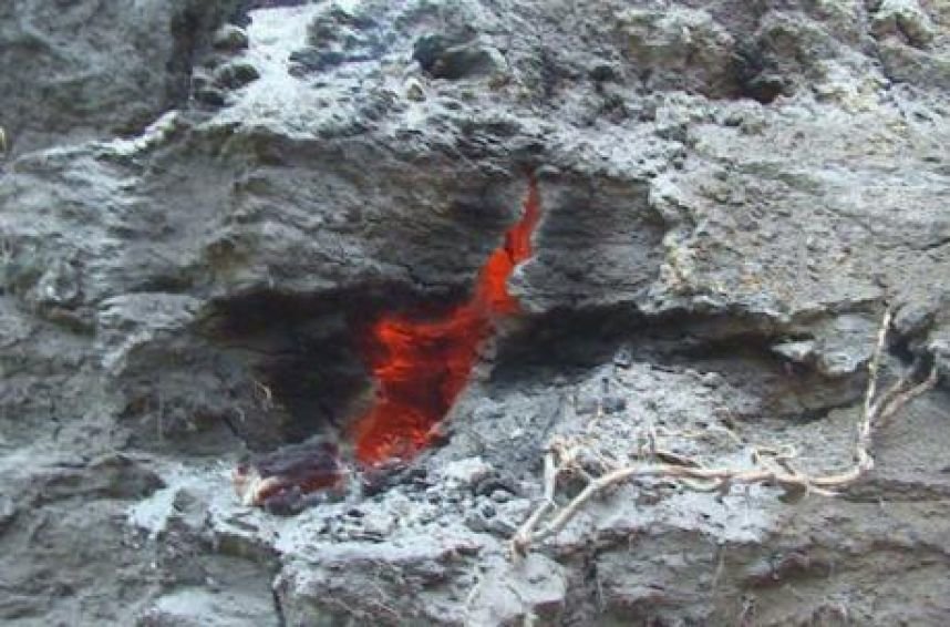 Incandescent material burning underground. 