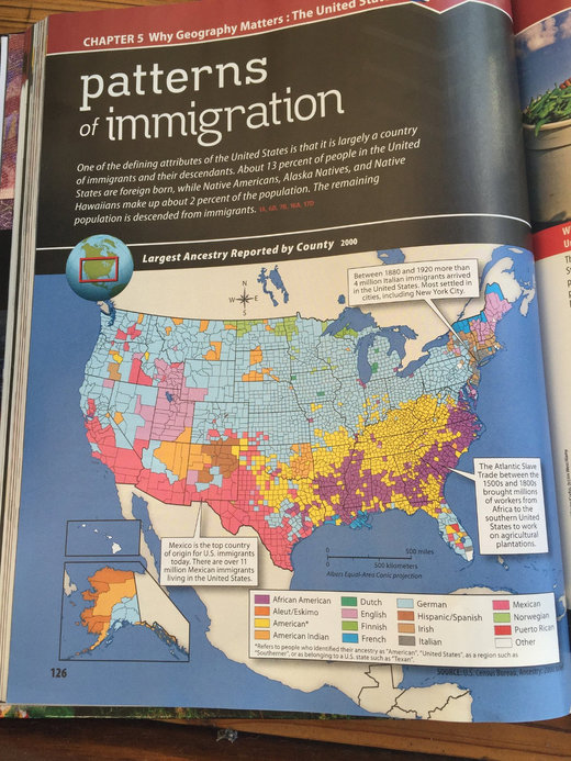 The page in a McGraw-Hill Education geography textbook that refers to Africans brought to American plantations as “workers,” rather than slaves.