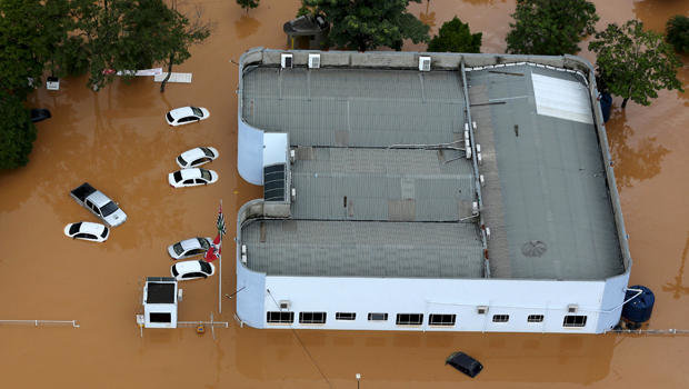 Cars are seen in a flooded street in the city of Franco da Rocha, in the north of Sao Paulo state, Brazil, March 11, 2016