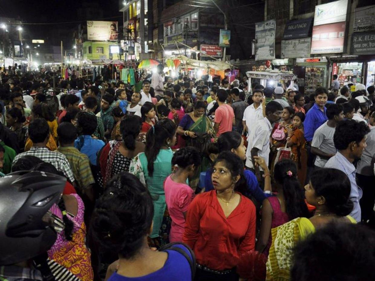 People crowd onto the street during an earthquake in Agartala, capital of India's northeastern state of Tripura, on April 13, 2016. 