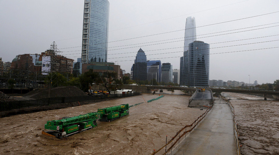 Crane on flooded street in Santiago