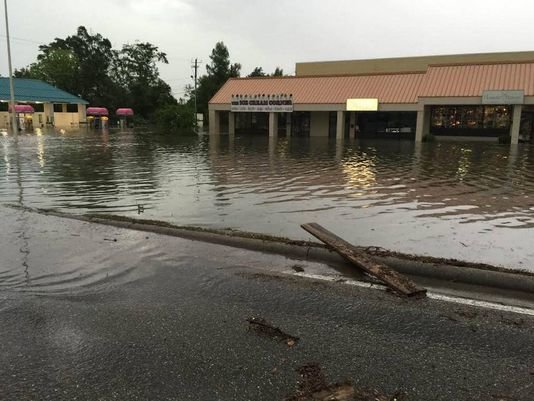 Areas along Dedeaux Road in Gulfport flood Thursday morning after heavy downpours.