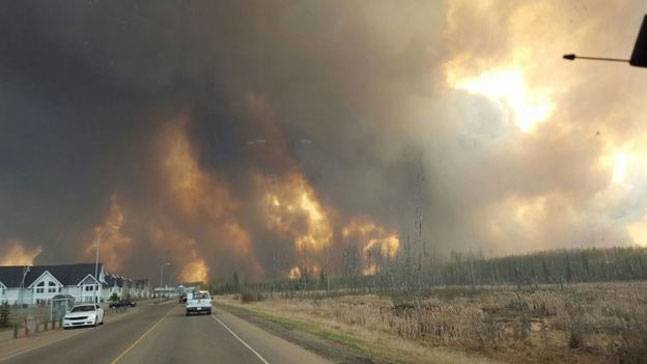 Residents fleeing the forest fire in Fort McMurray, Canada.