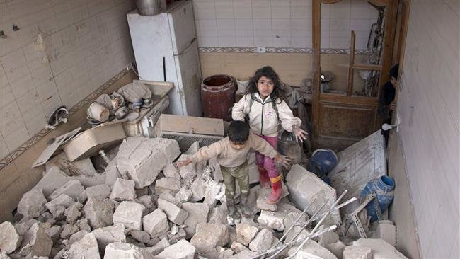 Syrian children on rubble