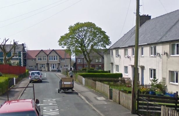 Click to enlarge Cops said there was blood all over the landing at the property on Robert Owen Ave in Cumbria