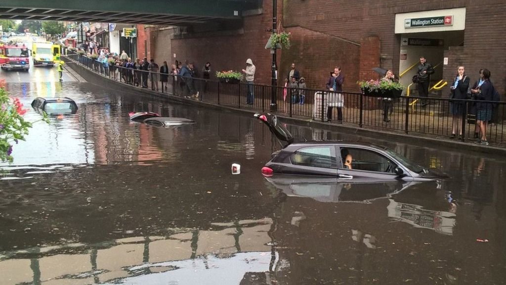 Three people were trapped in their cars after being submerged in flash floods in south-east London