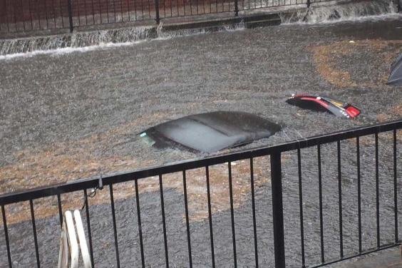 Submerged: a car after flash floods in south London 