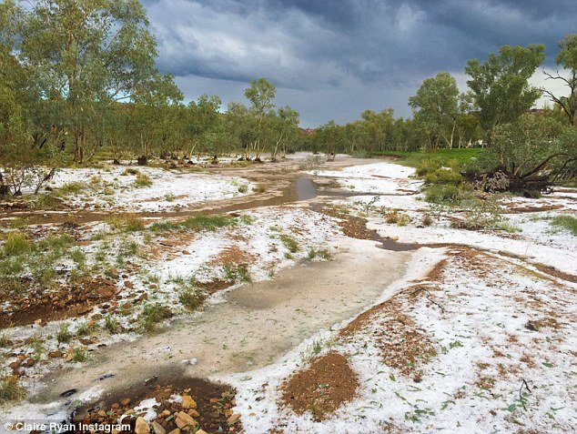 The freak storm uprooted trees and caused flash flooding, while parts of the Red Centre were covered in a sheet of white sleet