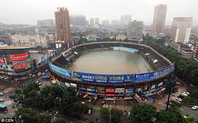 The football stadium in Erzhou was left completely swamped after heavy rain battered the city