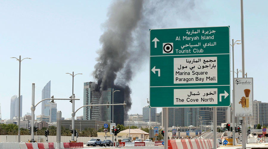 Smoke rises after a fire broke out in a building at Al Maryah Island in Abu Dhabi, UAE