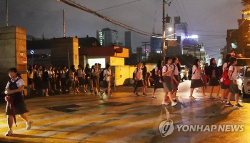 Click to enlarge Students evacuate from a school in the southern city of Ulsan on Sept. 12, 2016