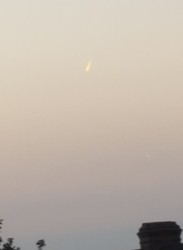 The UFO looked like a meteor or rocket, but was hovering in the sky 