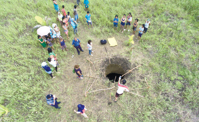 Sinkhole. Residents of Barangay Bugas in Badian town in southern Cebu are baffled by the sight of a seven-meter deep hole on the ground after heavy rains. 