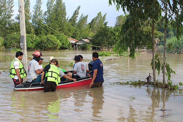 Rescue workers evacuate villagers in a badly-hit village in Chom Bung district, Ratchaburi. Flooding is widespread after nearly a week of rain. 