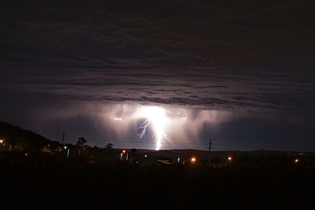 Click to enlarge Garry Wilkinson captured the stunning moment a giant lightning bolt hit Toowoomba.