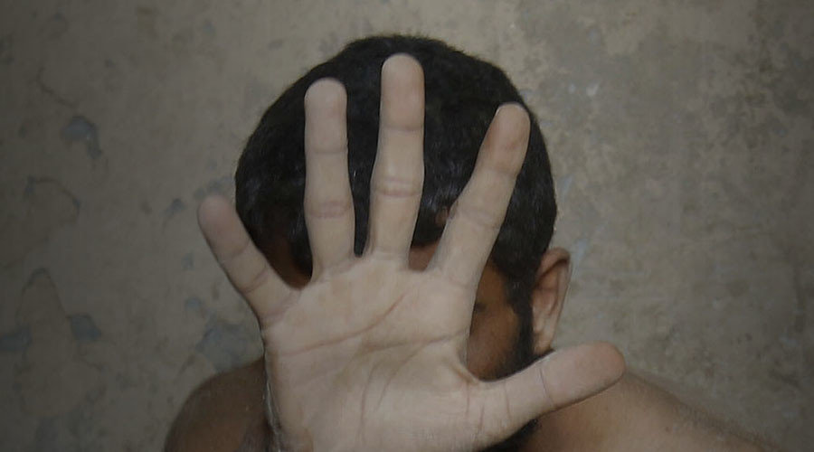 Man hiding face with hand