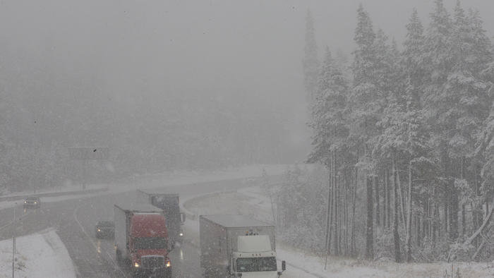 Vehicles drive through fog and light snow Oct. 17 on westbound Interstate 80 near Soda Springs. 