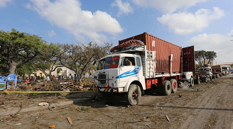 Trailers are seen parked outside a police cordon after a suicide car bomb went off at the entrance of Somalia's biggest port in its capital Mogadishu December 11, 2016