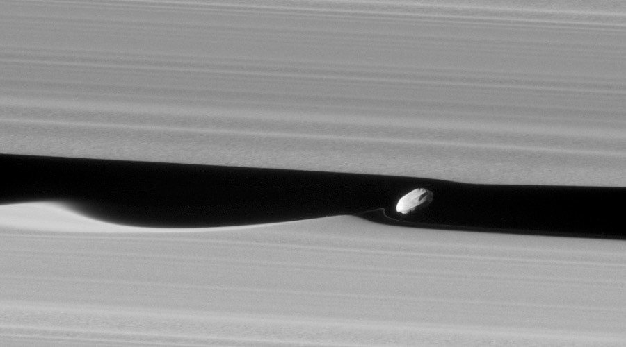 NASA's Cassini spacecraft captures Saturn's 'wavemaker' moon like never before