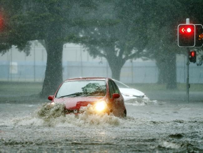 Drivers near the SCG drive through flood waters.