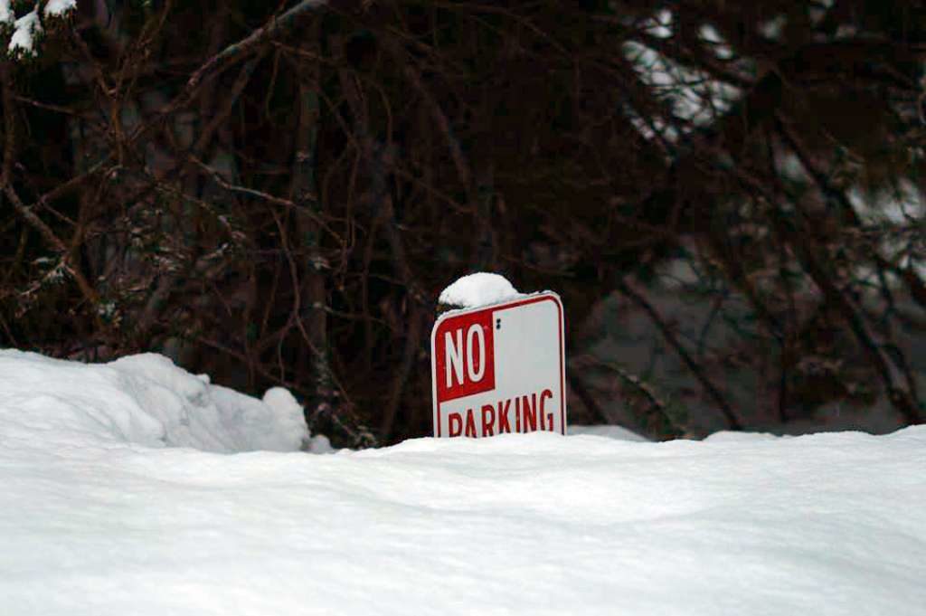 Snow piled up to the top of a No Parking sign in Truckee, Calif. 