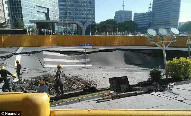 Jilin county council sent workers to repair the collapsed road near a construction site