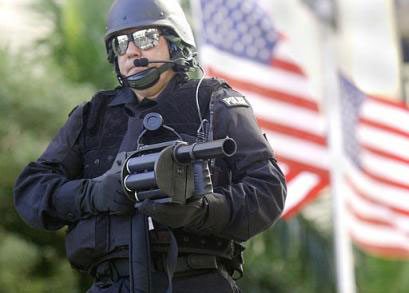Gunman in front of American flag