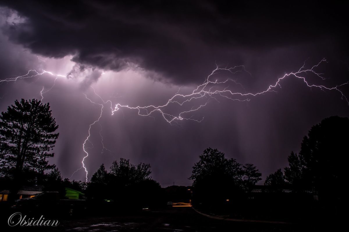 Lightning illuminates the sky Sunday night above the University Heights neighborhood in Flagstaff during a storm.