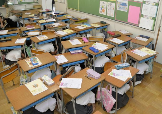 Children prepare for missile strike in Japanese classrooms