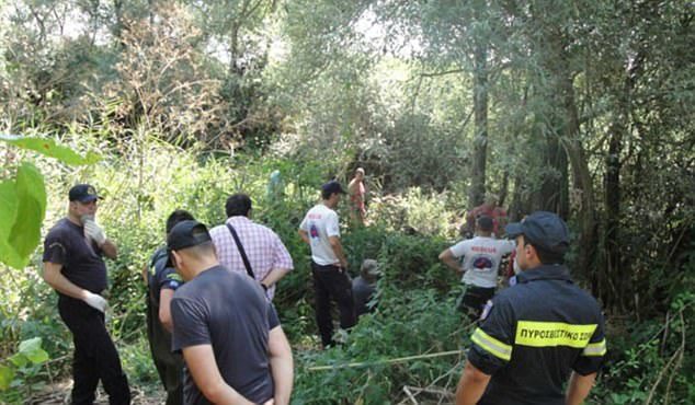 Authorities (pictured during the search) found the 64-year-old tourist dead on Saturday, with marks suggesting she had been savaged by animals in the northern region of Rodopi