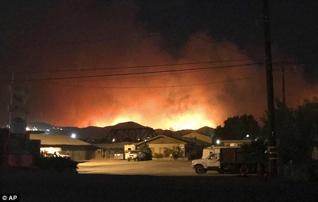 The 10,000-acre wildfire, known as the Thomas Fire, burned dry brush after erupting earlier in the evening in Ventura County (pictured)