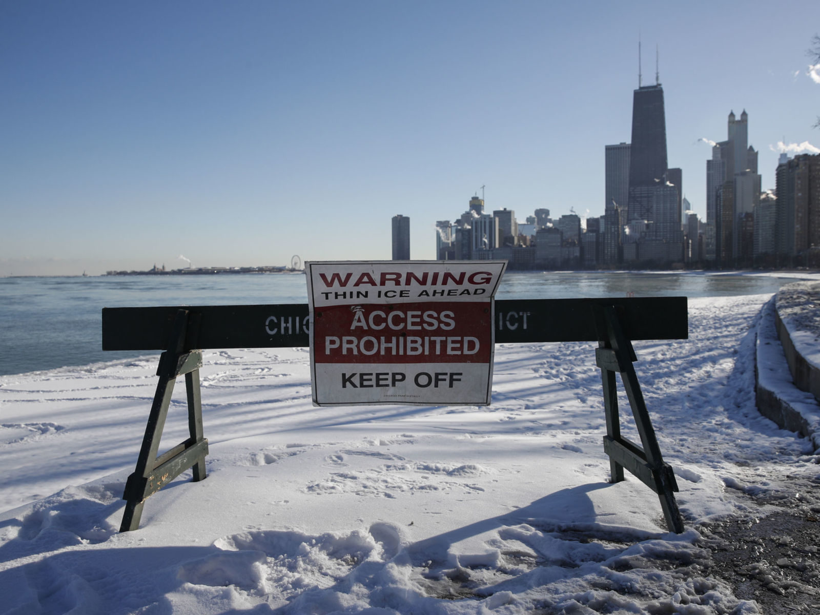 Pedestrians are warned away from the lakefront in Chicago, Illinois