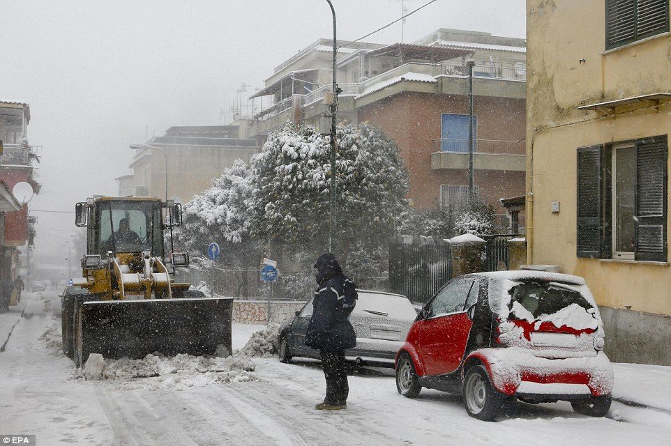 Snow is clear from a street in the Camaldoli's Hill, Naples. Residents have been told not to leave their homes unless it is 'strictly necessary'