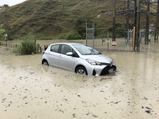 Hawke's Bay Today photographer's car caught in flooding in Eskdale area, near Napier. He only left it for 15 minutes!