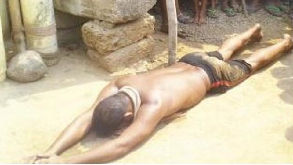 The baby’s father, Ramakrushna Nayak lies prostrate before God, praying for safety of his child in Talabasta village of Odisha’s Cuttack district.